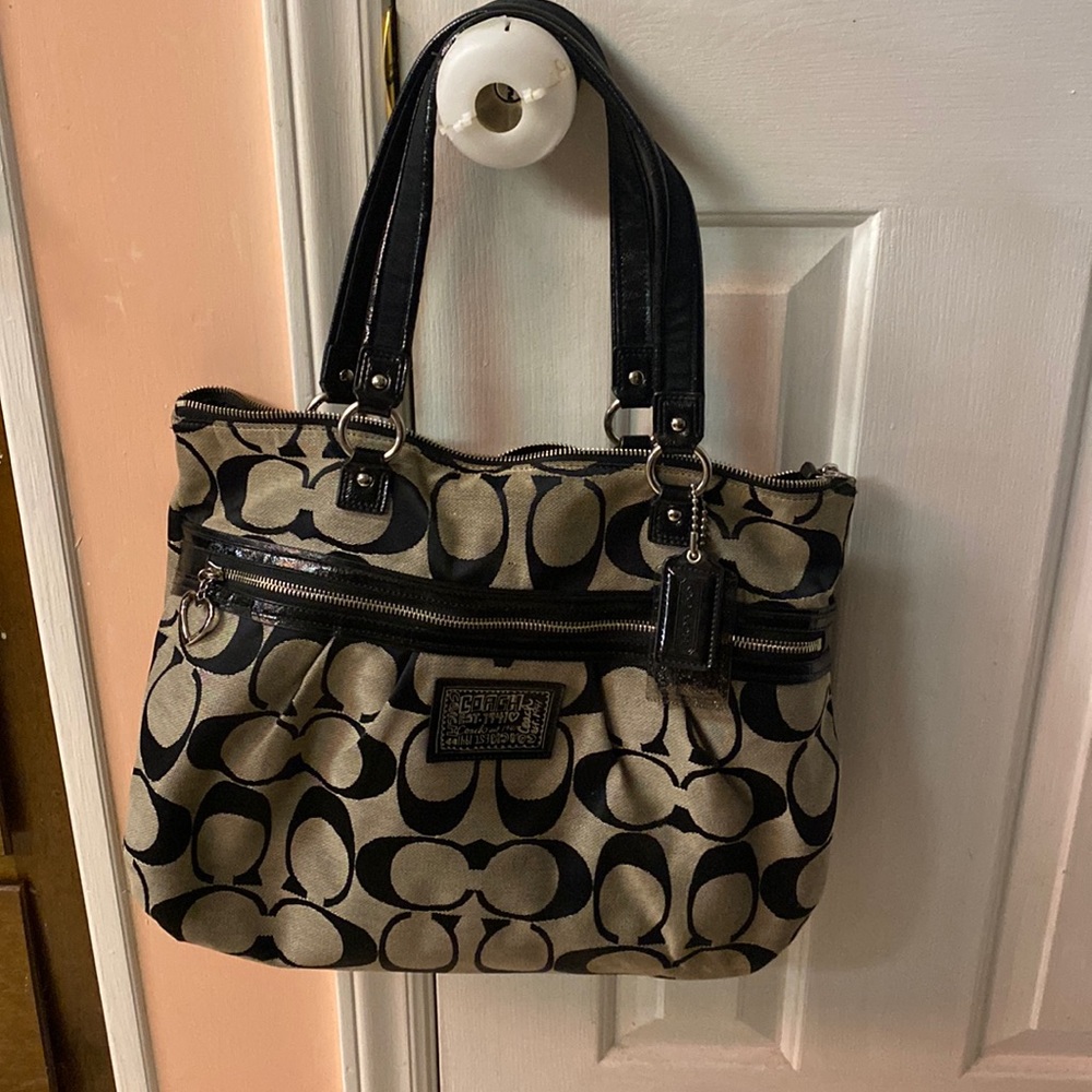 Coach tote gently used. See pictures for details in great condition.